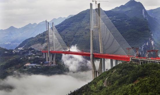 Construction work on the Beipan River expressway bridge (or Beipanjiang bridge) on September 10, 2016 in Bijie, Guizhou Province of China. (Photo by Visual China Group via Getty Images)